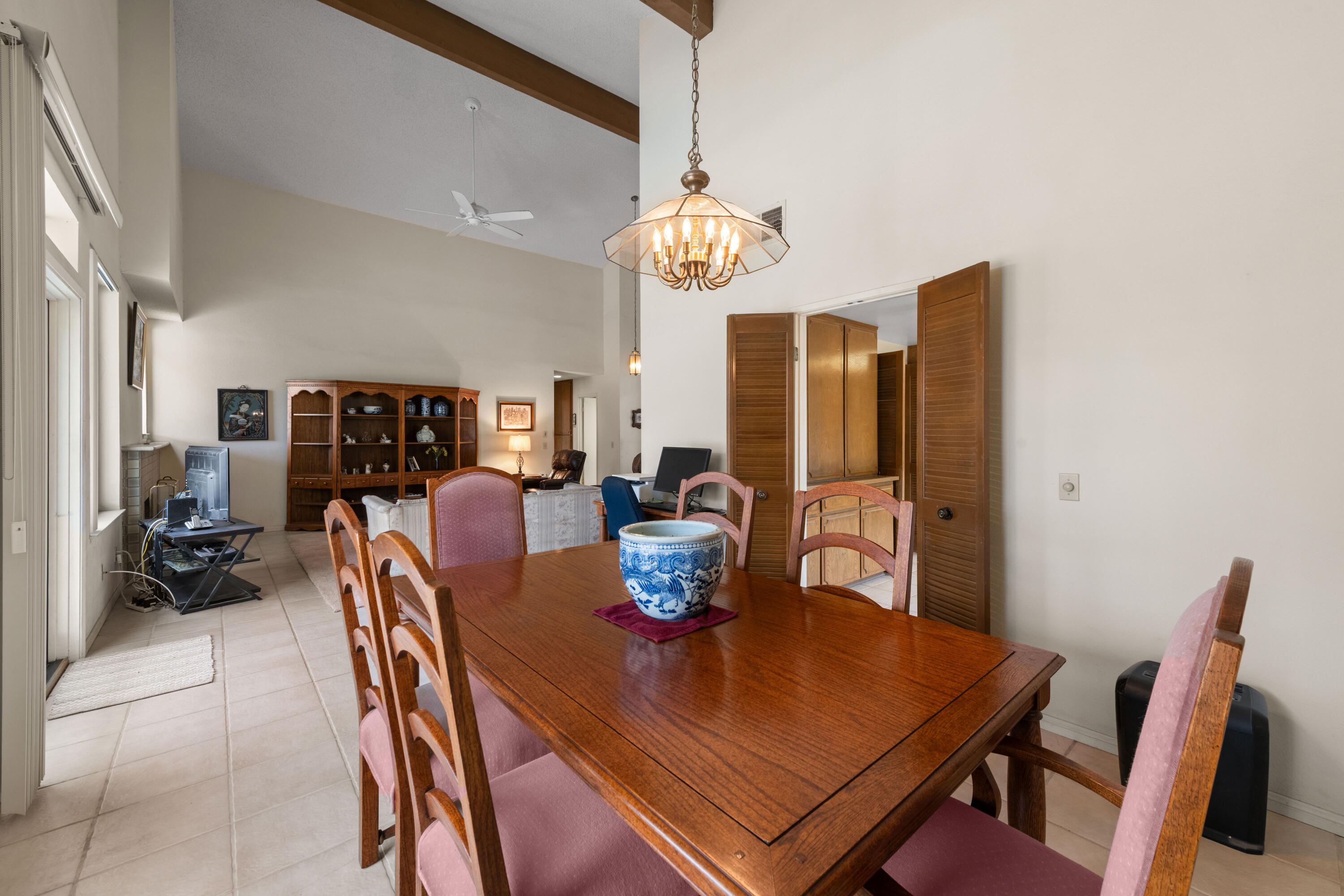 53 San Simeon Place Rancho Mirage, CA 92270 - Photo 8 of 30 a view of a dining room with furniture a chandelier and wooden floor