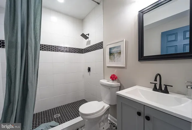 a bathroom with a bathtub and shower