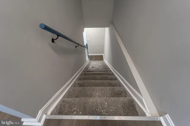 a view of an empty room with a fireplace