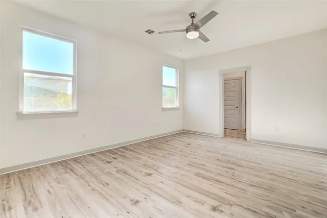 a kitchen with a sink and chandelier
