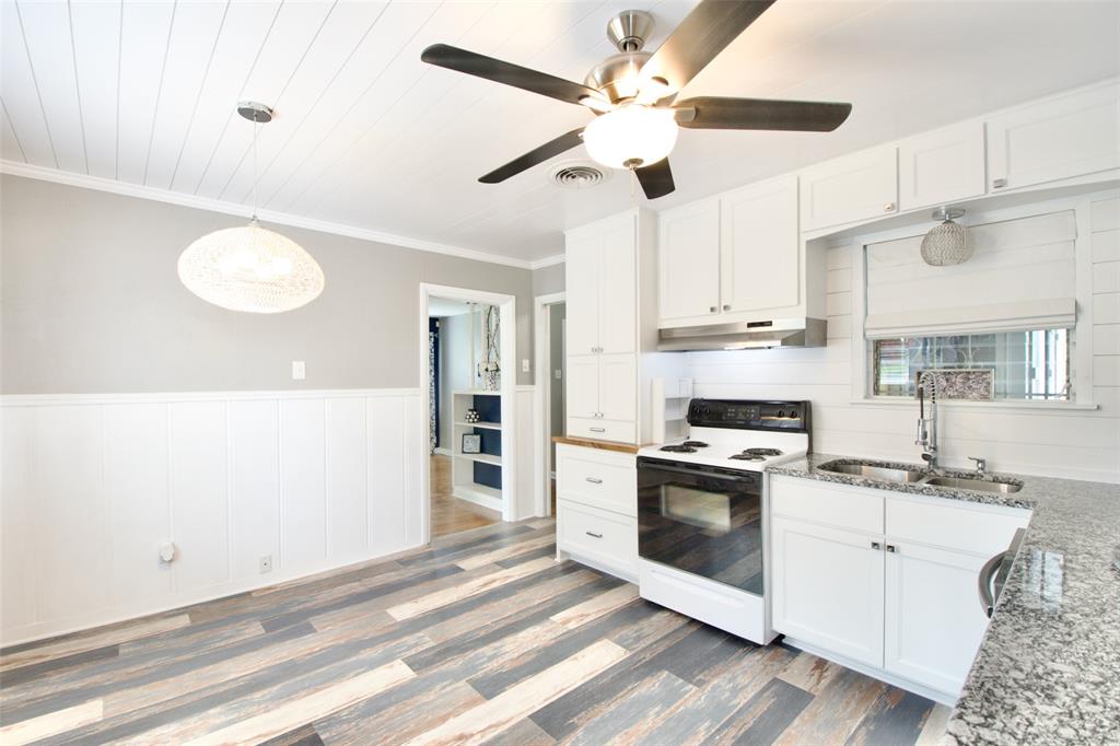 1307 North 65th Street Waco, TX 76710 - Photo 15 of 35 a kitchen with stainless steel appliances a stove a sink and a refrigerator