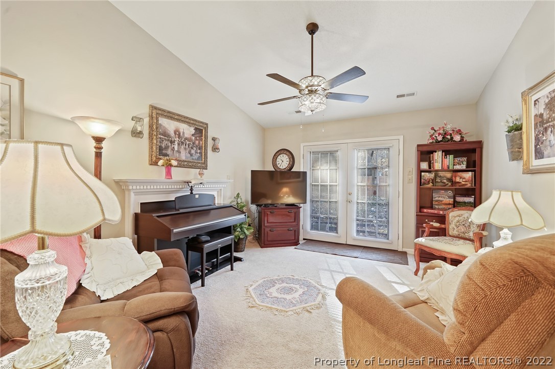 4372 Bona Court Raleigh, NC 27604 - Photo 12 of 41 a living room with furniture and a flat screen tv
