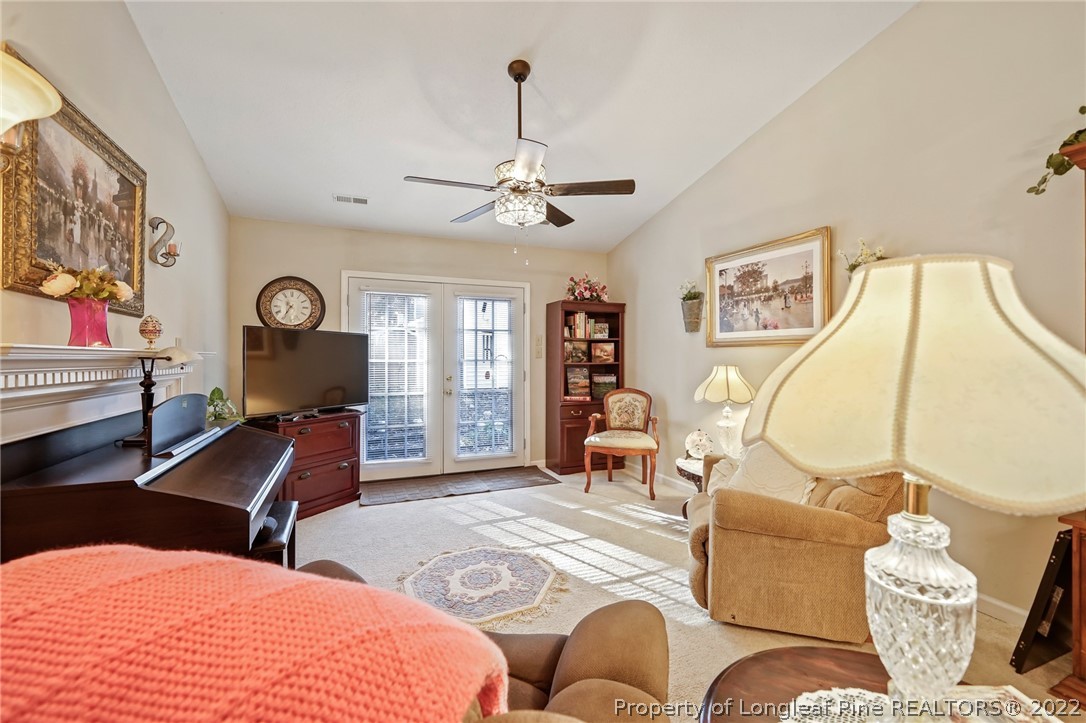 4372 Bona Court Raleigh, NC 27604 - Photo 16 of 41 a bedroom with a large bed and wooden floor