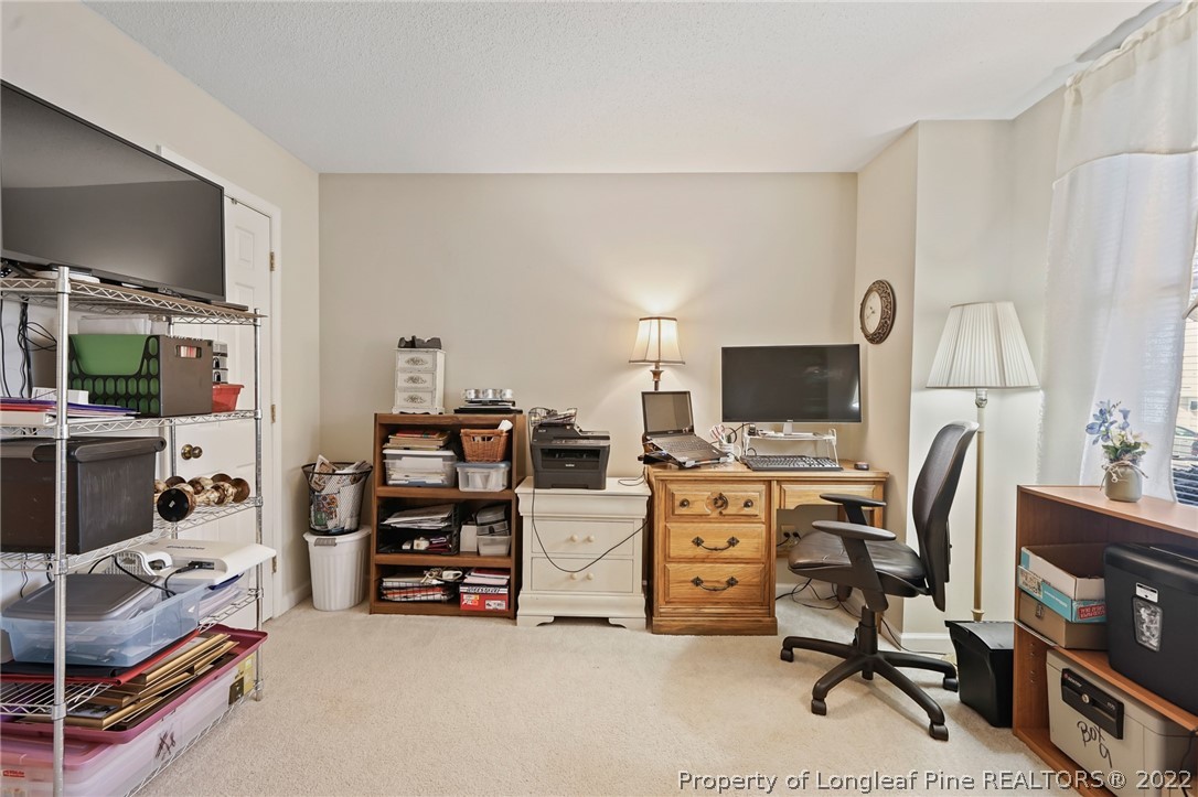 4372 Bona Court Raleigh, NC 27604 - Photo 29 of 41 a view of a livingroom with furniture and a flat screen tv