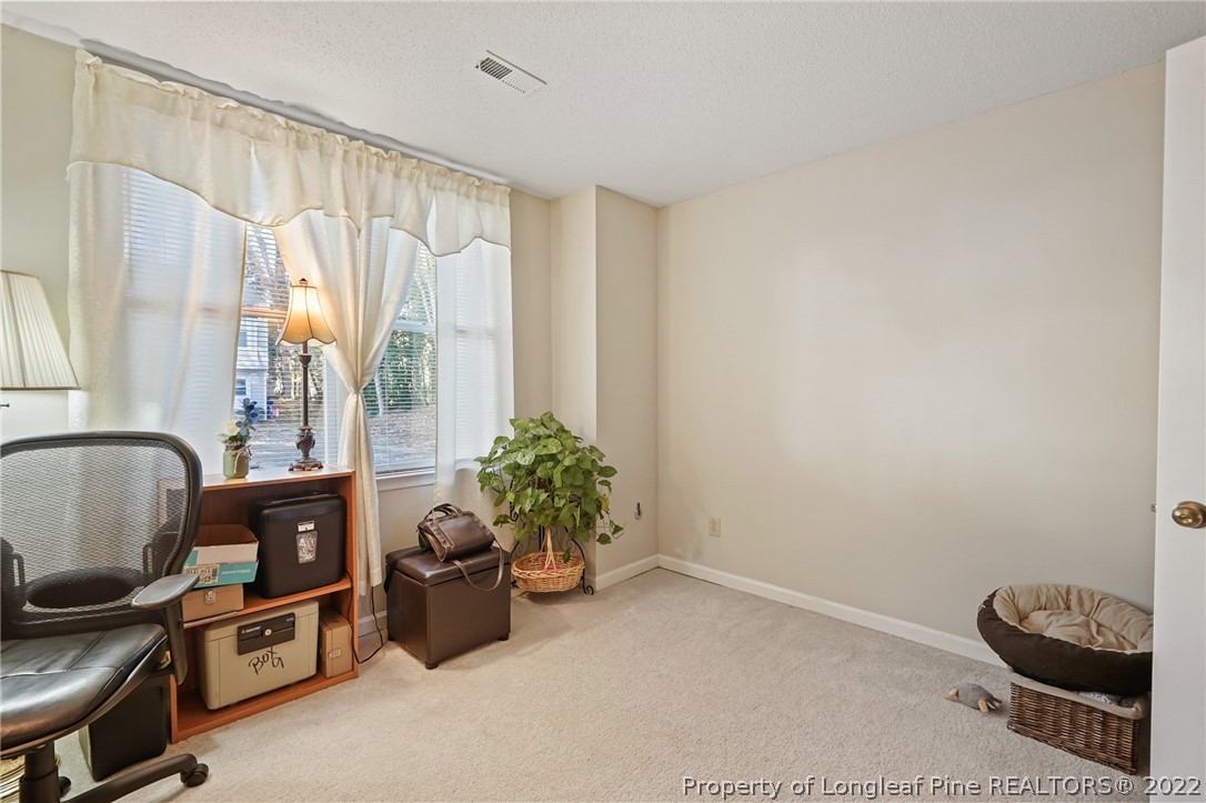 4372 Bona Court Raleigh, NC 27604 - Photo 32 of 41 a room with furniture and a chair