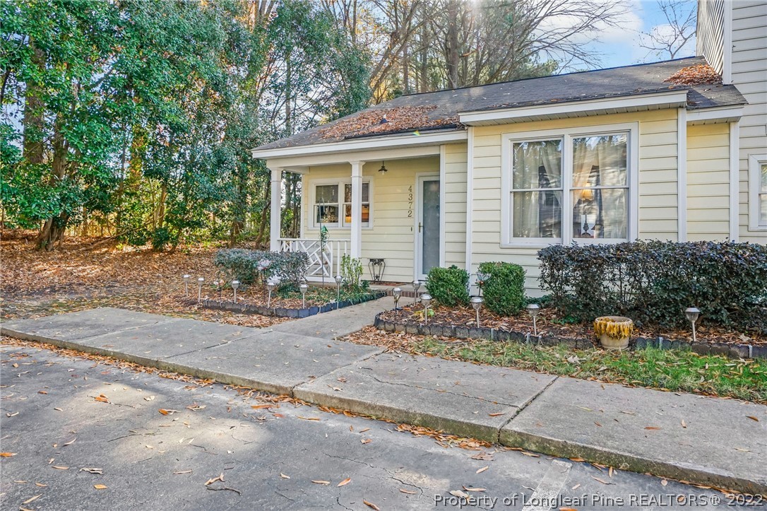 4372 Bona Court Raleigh, NC 27604 - Photo 36 of 41 a front view of a house with garden and plants