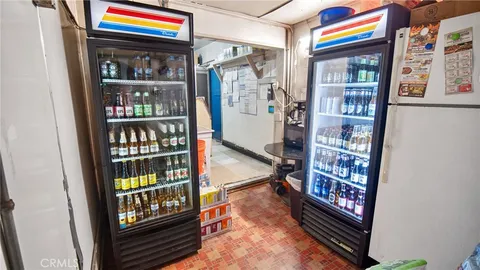 a view of water heater room with furniture and book shelf