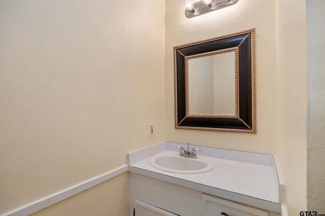 a view of a house with pool and wooden floor