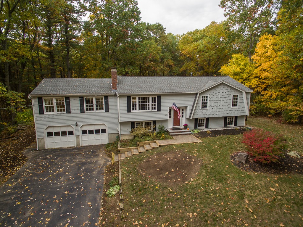597 Old Dunstable Road Groton, MA 01450 - Photo 1 of 21 front view of a house with a yard