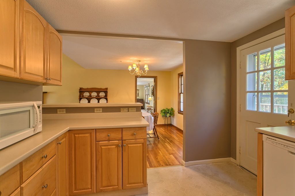 597 Old Dunstable Road Groton, MA 01450 - Photo 11 of 21 a kitchen with cabinets and window