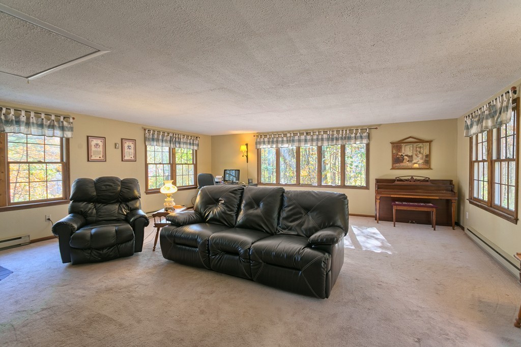597 Old Dunstable Road Groton, MA 01450 - Photo 13 of 21 a living room with furniture and a window