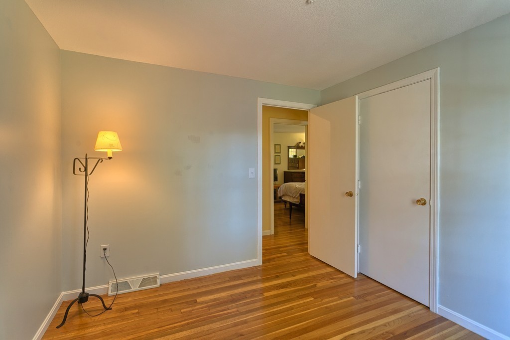 597 Old Dunstable Road Groton, MA 01450 - Photo 17 of 21 a view of a room with wooden floor
