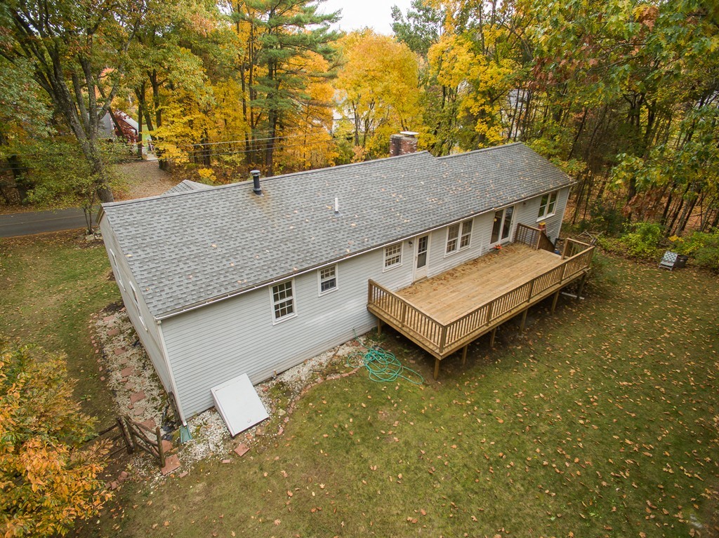 597 Old Dunstable Road Groton, MA 01450 - Photo 4 of 21 a view of a house with a backyard