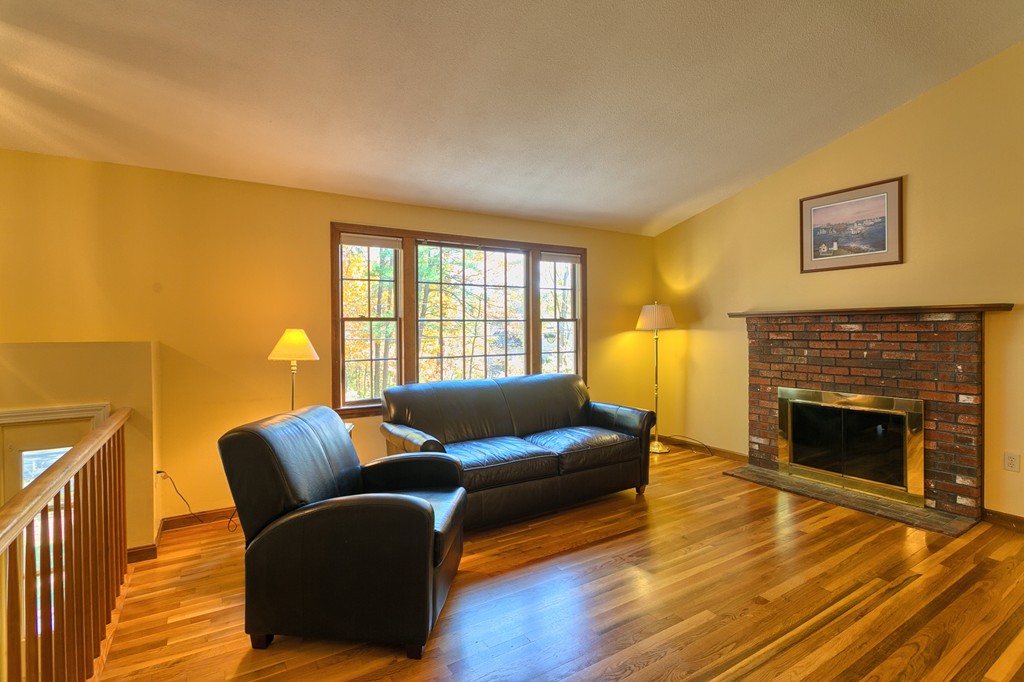 597 Old Dunstable Road Groton, MA 01450 - Photo 6 of 21 a living room with furniture and a fireplace