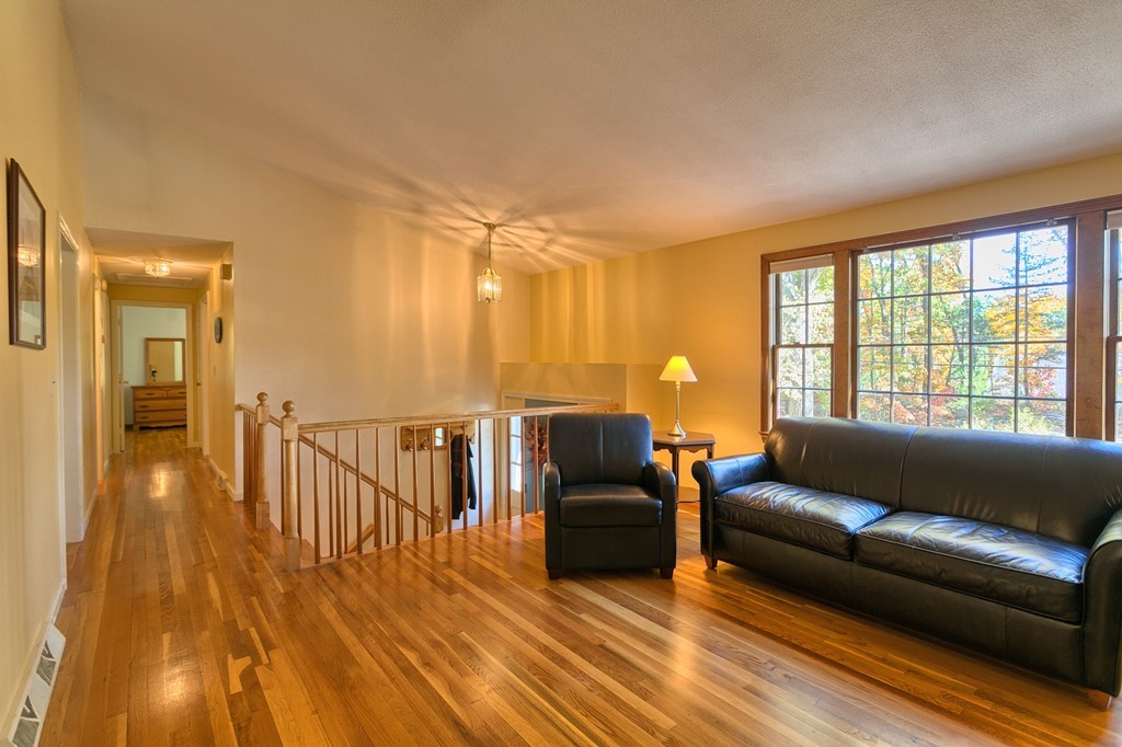 597 Old Dunstable Road Groton, MA 01450 - Photo 7 of 21 a living room with furniture and a wooden floor