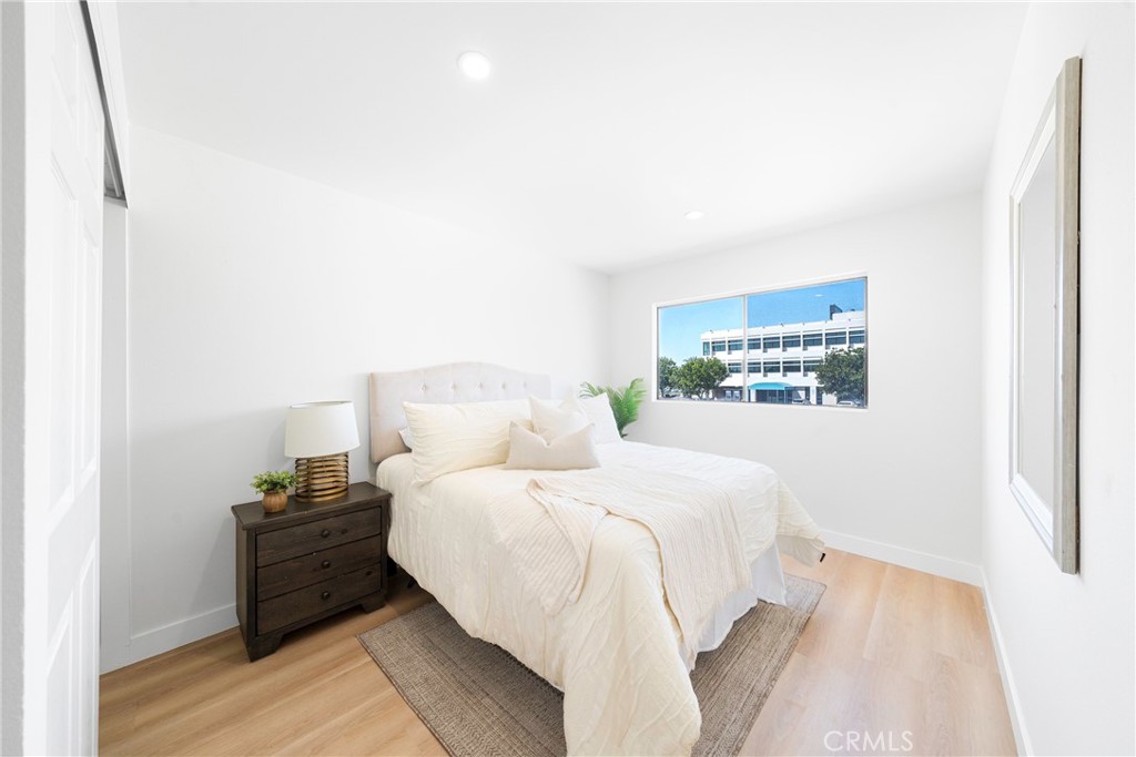 832 Cornwall Drive Anaheim, CA 92804 - Photo 17 of 30 a bedroom with a bed and a night stand