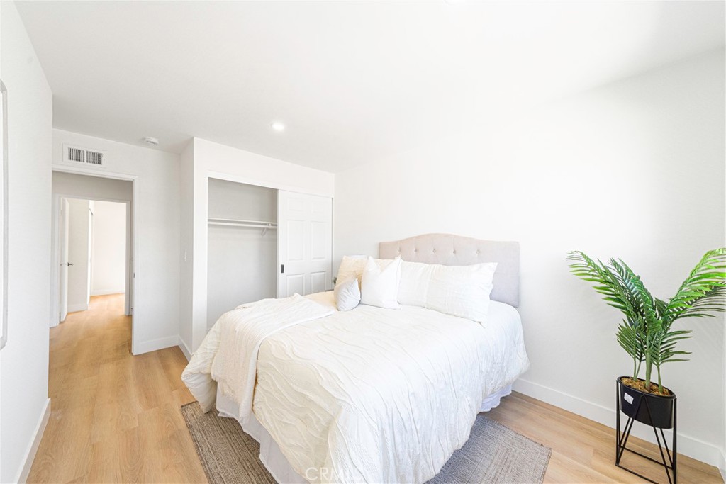 832 Cornwall Drive Anaheim, CA 92804 - Photo 18 of 30 a bedroom with a bed and a potted plant