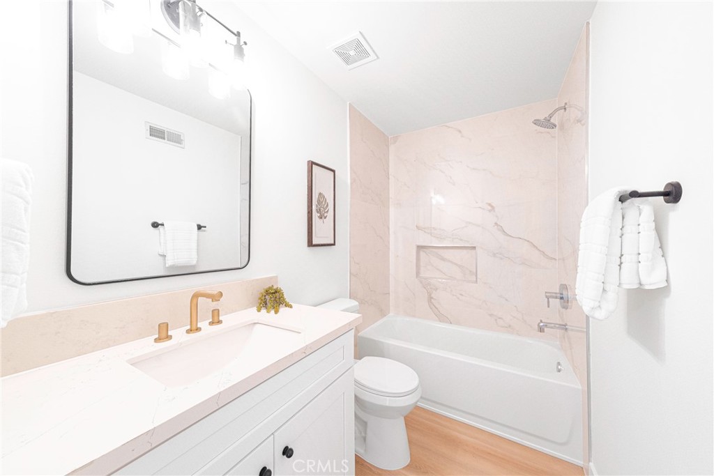 832 Cornwall Drive Anaheim, CA 92804 - Photo 21 of 30 a bathroom with a sink vanity granite tub and shower