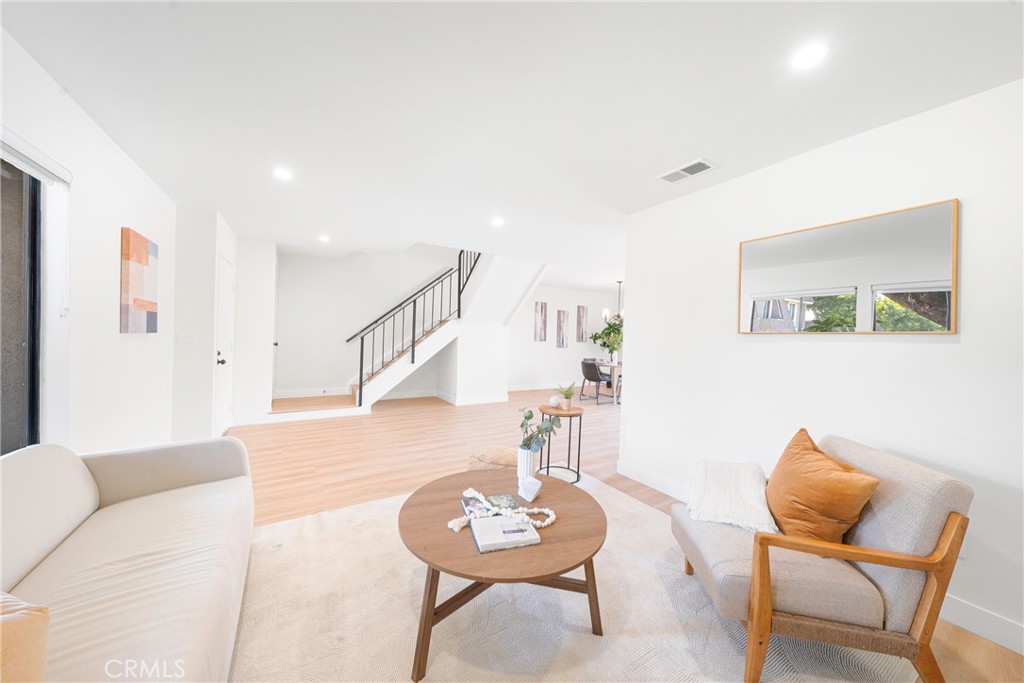 832 Cornwall Drive Anaheim, CA 92804 - Photo 6 of 30 a living room with furniture and a wooden floor