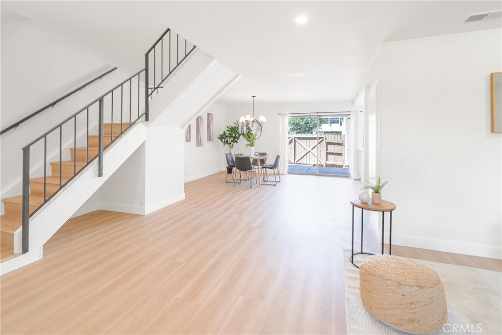 832 Cornwall Drive Anaheim, CA 92804 - Photo 7 of 30 a living room with furniture and a wooden floor