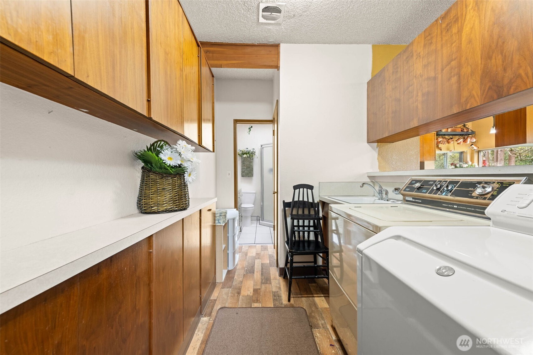 1007 Panorama Court Fircrest, WA 98466 - Photo 16 of 39 a view of a kitchen with a stove and a window