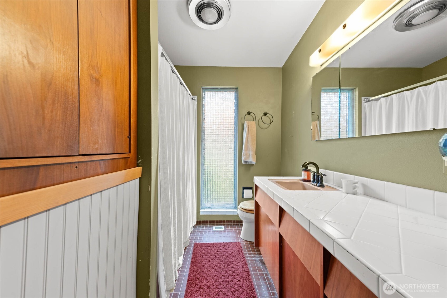 1007 Panorama Court Fircrest, WA 98466 - Photo 23 of 39 a bathroom with a sink and a mirror