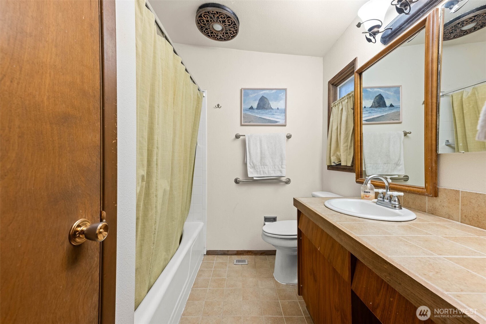 1007 Panorama Court Fircrest, WA 98466 - Photo 26 of 39 a bathroom with a granite countertop sink mirror vanity and toilet