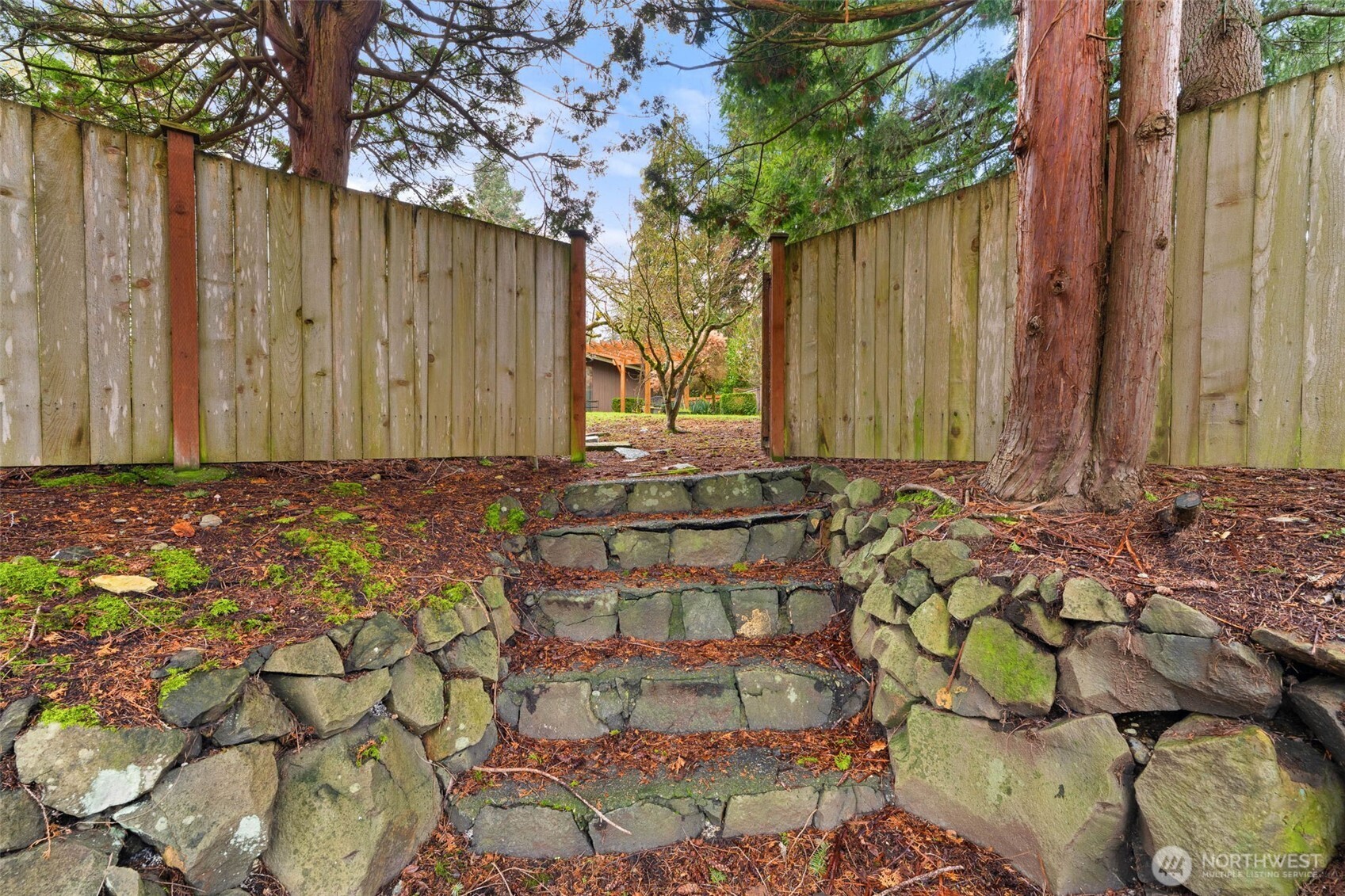 1007 Panorama Court Fircrest, WA 98466 - Photo 36 of 39 a view of a house with a wooden fence