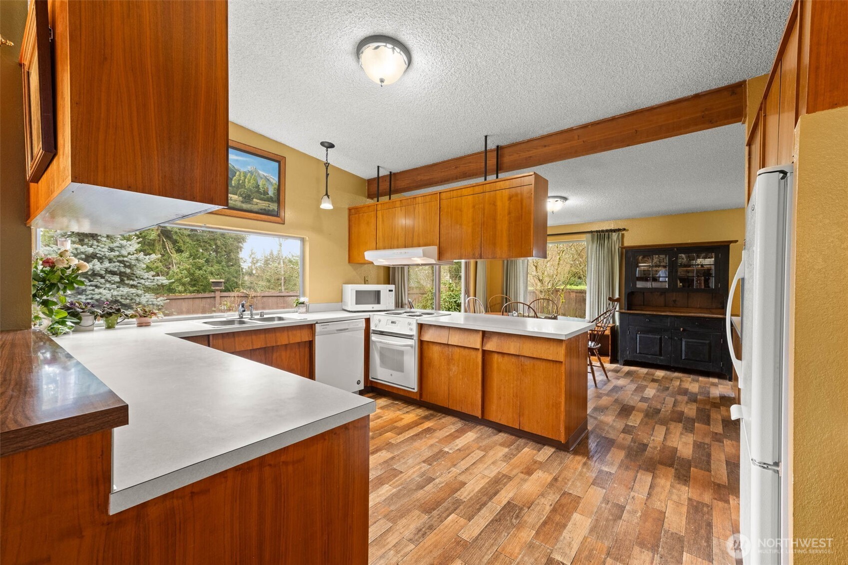 1007 Panorama Court Fircrest, WA 98466 - Photo 7 of 39 a kitchen with stainless steel appliances granite countertop a sink and cabinets