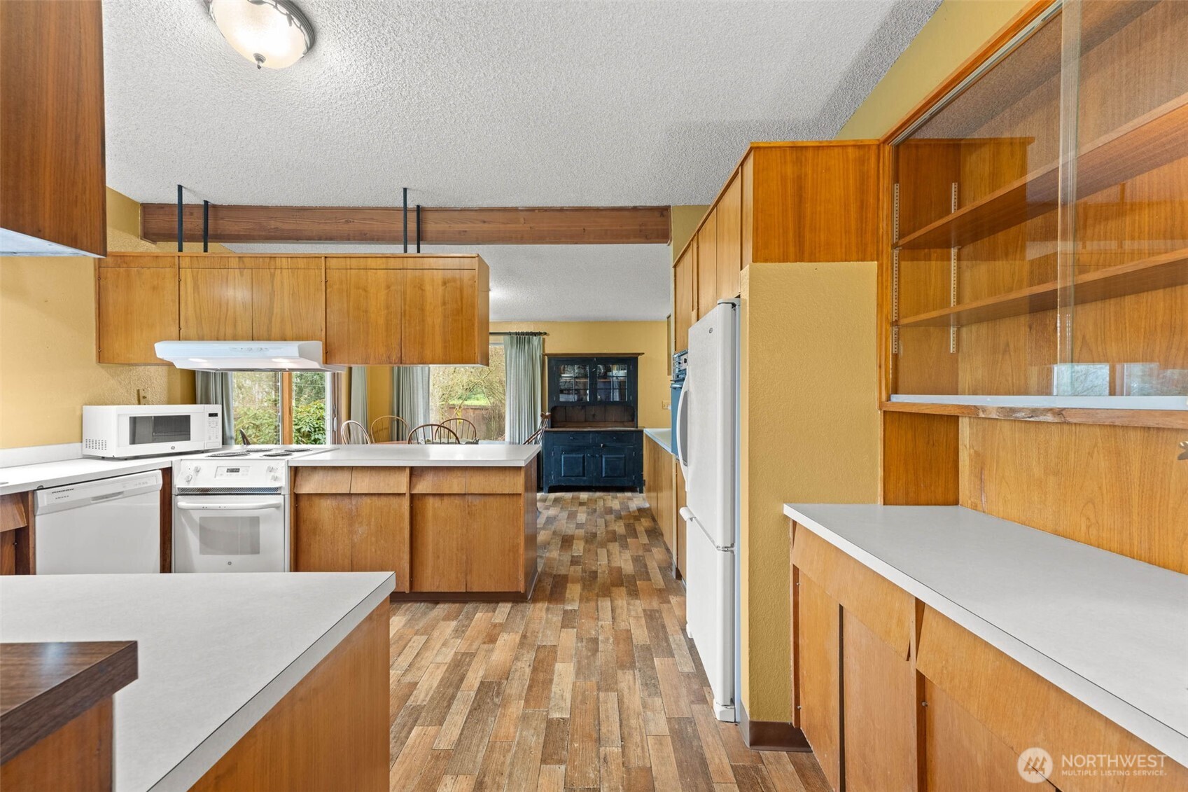 1007 Panorama Court Fircrest, WA 98466 - Photo 8 of 39 a kitchen with kitchen island a stove a sink dishwasher and a refrigerator