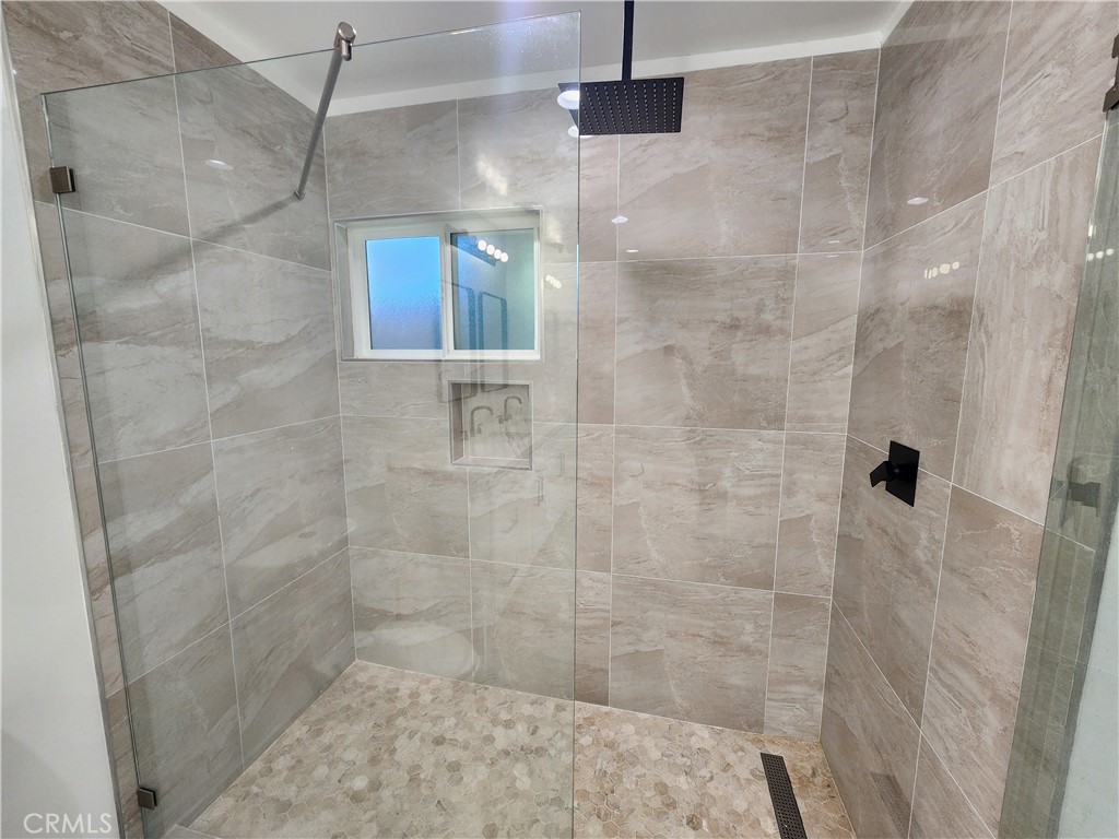 7665 Machrea Street Tujunga, CA 91042 - Photo 20 of 43 a bathroom with a shower
