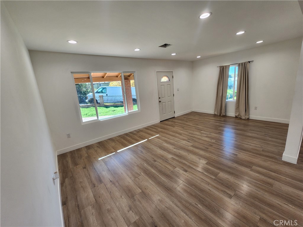 7665 Machrea Street Tujunga, CA 91042 - Photo 35 of 43 wooden floor in an empty room with a window