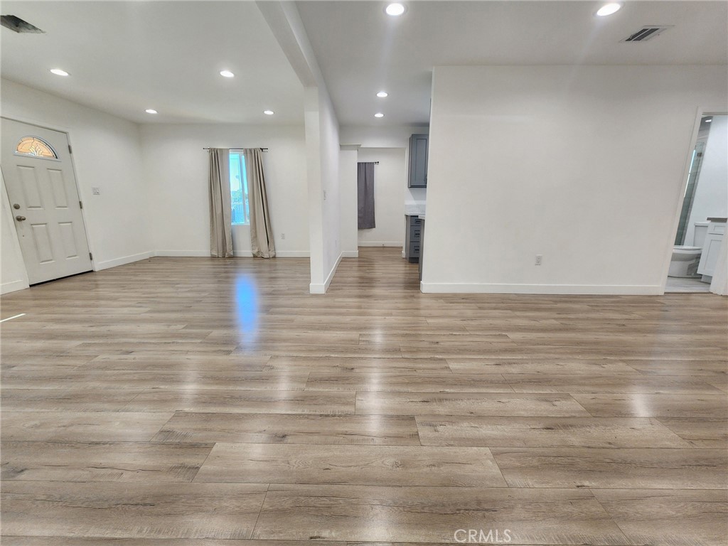 7665 Machrea Street Tujunga, CA 91042 - Photo 40 of 43 a view of an empty room with wooden floor
