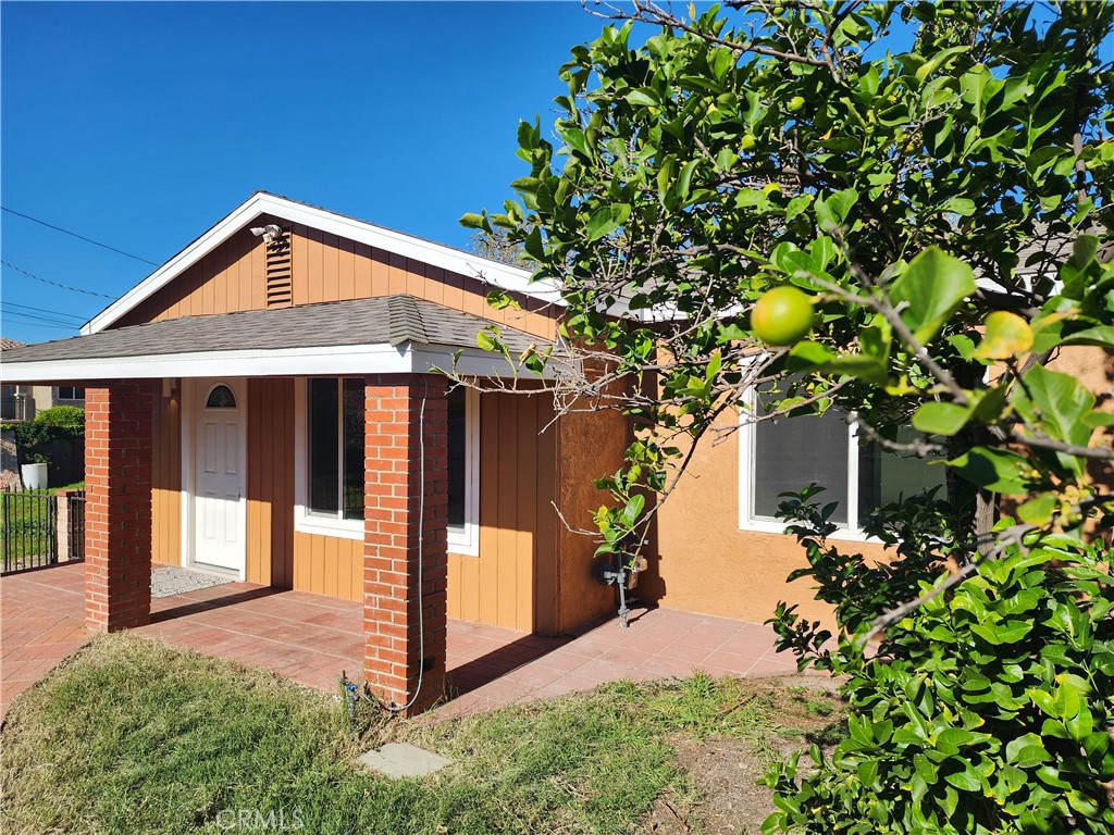 7665 Machrea Street Tujunga, CA 91042 - Photo 42 of 43 a front view of a house with a yard