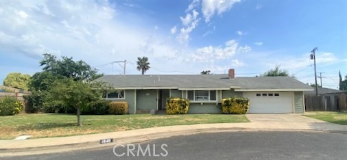 a view of a house with a yard and plants