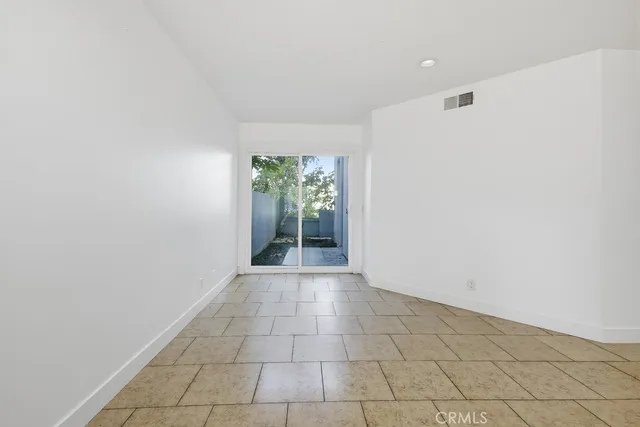 a kitchen with a stove a microwave and a refrigerator