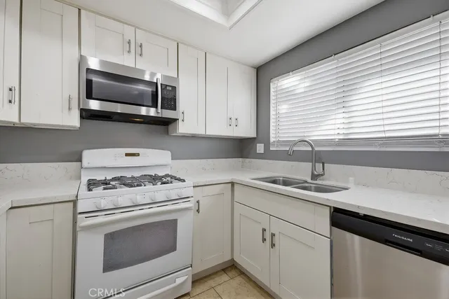 a kitchen with a sink and a window