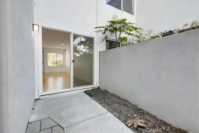 a view of multiple houses with a street
