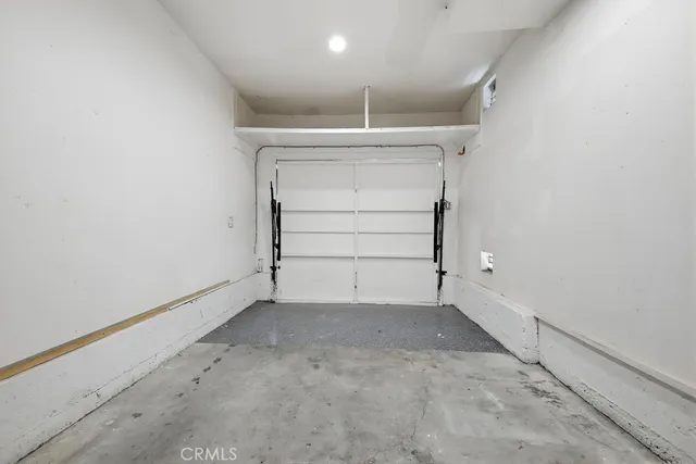 an aerial view of a house with swimming pool and patio