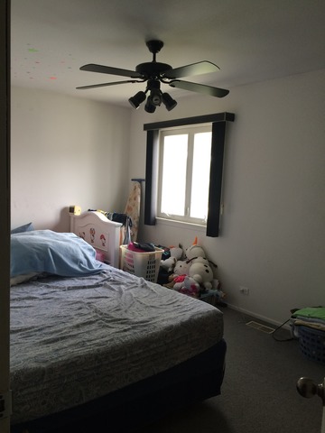 726 East Old Willow Road, Unit 104C Prospect Heights, IL 60070 - Photo 5 of 6 a bedroom with a bed and a chandelier