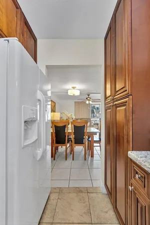 a view of dining area with stainless steel appliances granite countertop furniture