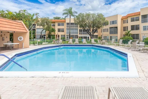 a view of pool with outdoor seating