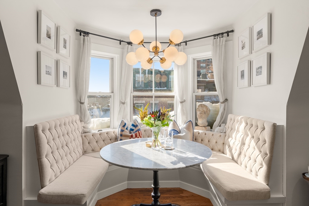 13 Upton Street, Unit 6 Boston, MA 02118 - Photo 1 of 27 a living room with furniture and a large window