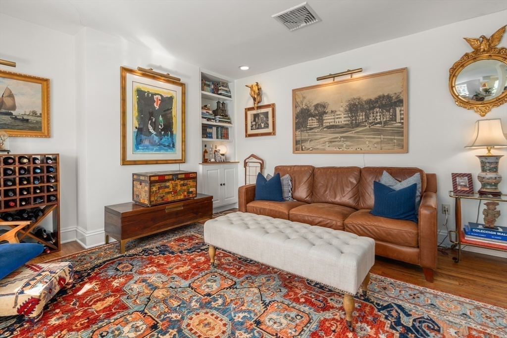 13 Upton Street, Unit 6 Boston, MA 02118 - Photo 11 of 27 a living room with furniture and a rug