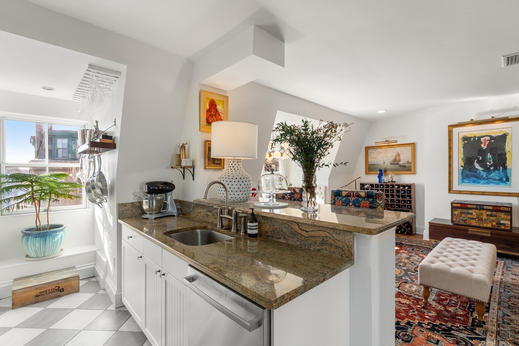 13 Upton Street, Unit 6 Boston, MA 02118 - Photo 13 of 27 a kitchen with stainless steel appliances granite countertop a sink stove and cabinets