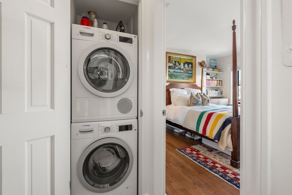 13 Upton Street, Unit 6 Boston, MA 02118 - Photo 17 of 27 a view of a bedroom with washer and dryer
