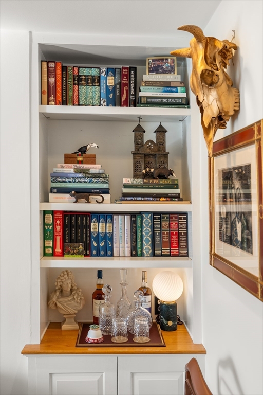 13 Upton Street, Unit 6 Boston, MA 02118 - Photo 21 of 27 a shelf with books and knick knacks on it