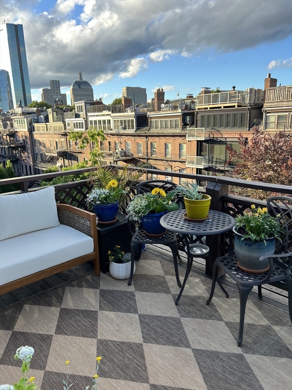 13 Upton Street, Unit 6 Boston, MA 02118 - Photo 27 of 27 a view of a chairs and table in a terrace