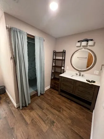 a bathroom with a sink and a window