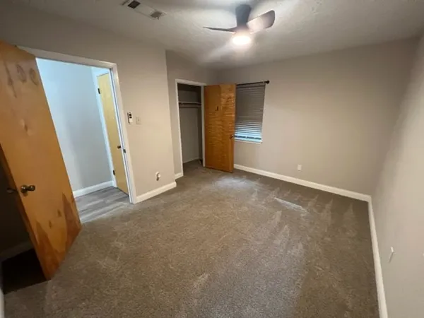 a view of an empty room and window